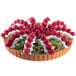 A fluted non-stick tart with kiwi and raspberries on top.