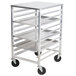 An Advance Tabco metal sheet pan rack with four shelves and wheels.