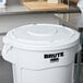 A white Rubbermaid lid for a 55 gallon Brute trash can.
