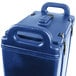 A navy blue plastic Cambro soup carrier with handles.