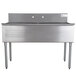 An Advance Tabco stainless steel sink with two compartments and a faucet over a counter.