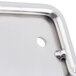A close up of a silver metal American Metalcraft Pizza Peel Rack with a hole in a metal corner.