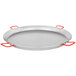 A large silver Matfer Bourgeat carbon steel paella pan with red handles.
