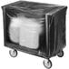 A black covered Cambro dish cart on wheels.