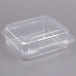 A Dart clear plastic hinged medium container.