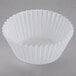 A white fluted baking cupcake wrapper.
