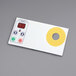 A white rectangular Doyon Baking Equipment electronic panel with buttons and a yellow circle.