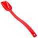 A red Cambro Camwear salad bar spoon with a handle.