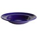 A white Tuxton bowl with a cobalt blue interior and blue lines.