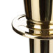 A brass Aarco rope style crowd control stanchion.
