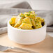 A bowl of potato salad with Admiration Yellow Mustard.