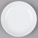 A white GET Water Lily melamine sauce dish on a gray surface.