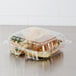 A Dart ClearSeal clear plastic container with three compartments holding food.