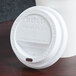 A Solo white plastic lid on a cup.
