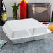 Dart 95HT3R 9 1/2" x 9" x 3" White Foam Three-Compartment Square Take Out Container with Hinged Lid - 200/Case Main Thumbnail 4