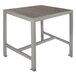 A BFM Seating metal bar height table with a gray synthetic teak top.
