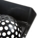 A black plastic dome floor sink strainer with holes.