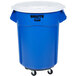 A blue Rubbermaid BRUTE trash can with white lid and dolly.