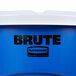 A blue Rubbermaid BRUTE trash can with white lid.