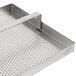 A stainless steel FMP floor sink strainer with a metal grid with holes.