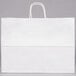 A Duro white paper shopping bag with handles.