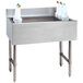 A stainless steel Advance Tabco underbar ice bin with a 10-circuit cold plate filled with ice and white containers.