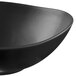 A close up of a black Libbey Driftstone bowl with a curved edge.