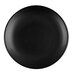 A close up of a black Libbey Driftstone porcelain coupe plate with a matte finish.