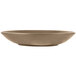 A close up of a Libbey sand satin matte porcelain coupe bowl with a brown rim.