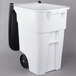 A white Rubbermaid rectangular trash can with black wheels and a black lid.