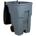 A grey Rubbermaid commercial trash can with black wheels and a black lid.
