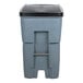 A Rubbermaid grey plastic bin with a black lid.