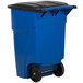 A blue Rubbermaid recycling bin with wheels and a lid.