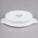 A white porcelain Libbey Reflections rarebit dish with a handle.