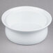 A white Libbey porcelain casserole dish on a gray surface.