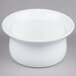 A white Libbey medium porcelain ramekin on a gray surface.