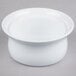 A white Libbey porcelain casserole dish with a rim on a gray surface.