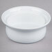 A close-up of a Libbey medium white porcelain pot pie dish on a gray surface.
