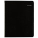 A black At-A-Glance weekly planner with a silver spiral binding.