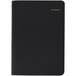 An At-A-Glance black daily appointment book with gold lettering on the cover.