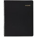 An At-A-Glance black monthly business planner with spiral binding and gold writing on the cover.