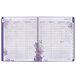 An At-A-Glance spiral bound planner with purple flowers on the cover.
