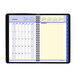 A spiral bound black and white At-A-Glance calendar with numbers and days of the month.