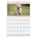 An At-A-Glance wirebound wall calendar with a puppy running on it.
