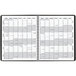 A black At-A-Glance monthly planner with a spiral binding and white calendar pages.