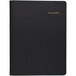 A black At-A-Glance monthly planner with gold text on the cover.
