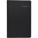 A black notebook with gold text on the cover.