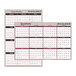 An At-A-Glance 24" x 36" black and red reversible quarterly wall planner with dates and numbers.