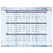 A At-A-Glance desk pad calendar with a blue border, numbers, and months.