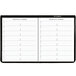 A black At-A-Glance padfolio with white monthly planner pages.
